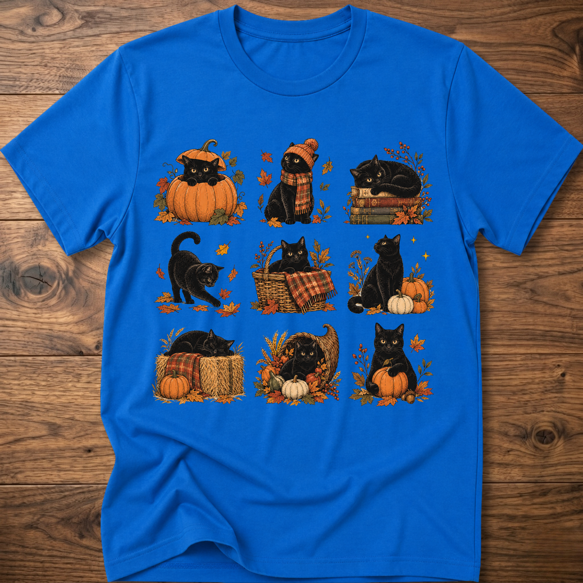 Royal blue cats in autumn graphic T-shirt with pumpkin, scarf, and leaf cat art