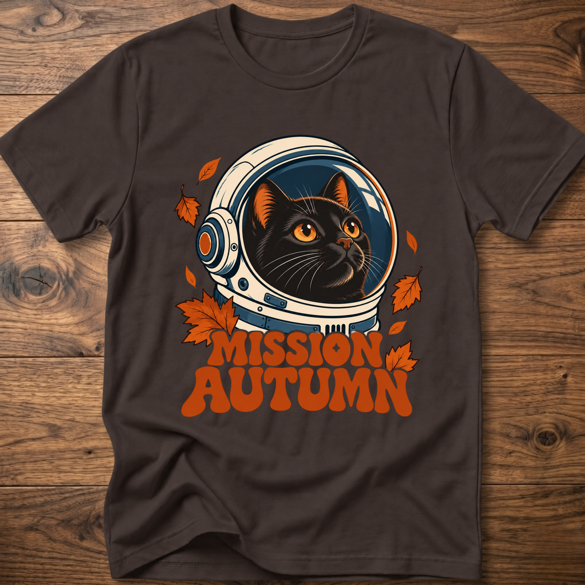 Dark brown cat astronaut graphic t-shirt with “Mission Autumn” and leaf accents