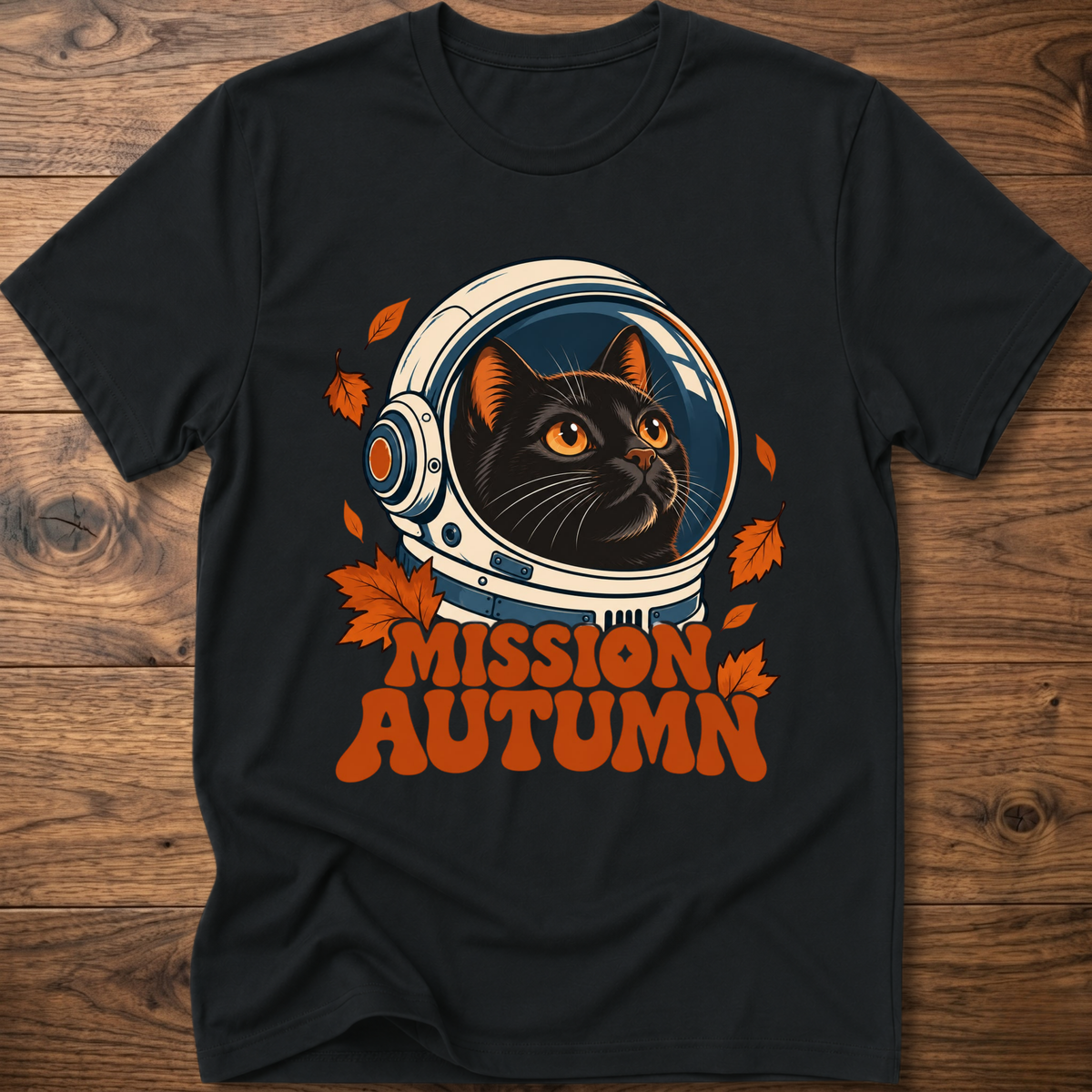 Black cat astronaut graphic t-shirt with “Mission Autumn” lettering and leaf details