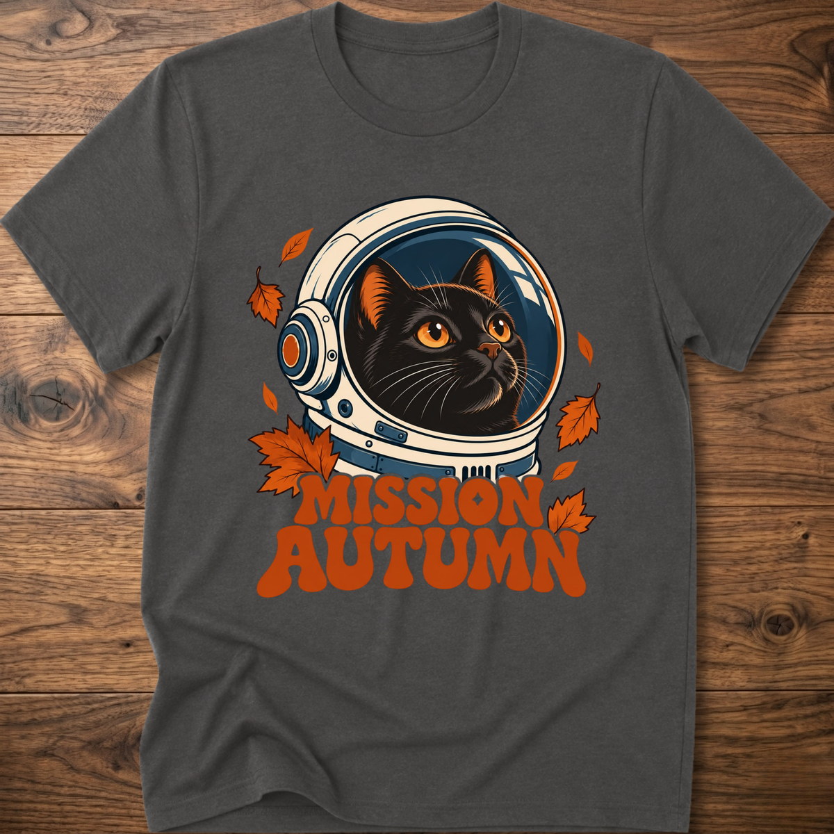 Charcoal gray cat astronaut graphic t-shirt with “Mission Autumn” lettering and leaves
