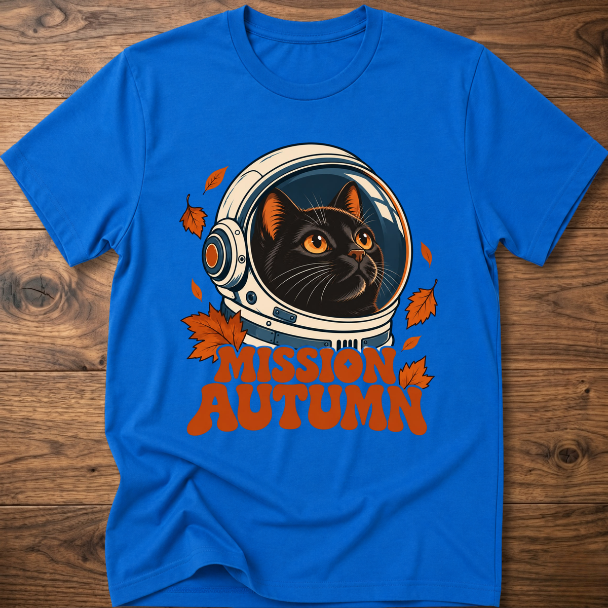 Royal blue cat astronaut graphic t-shirt with “Mission Autumn” lettering and leaves