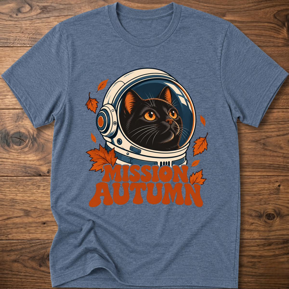 Heather indigo cat astronaut graphic t-shirt with “Mission Autumn” text and leaves