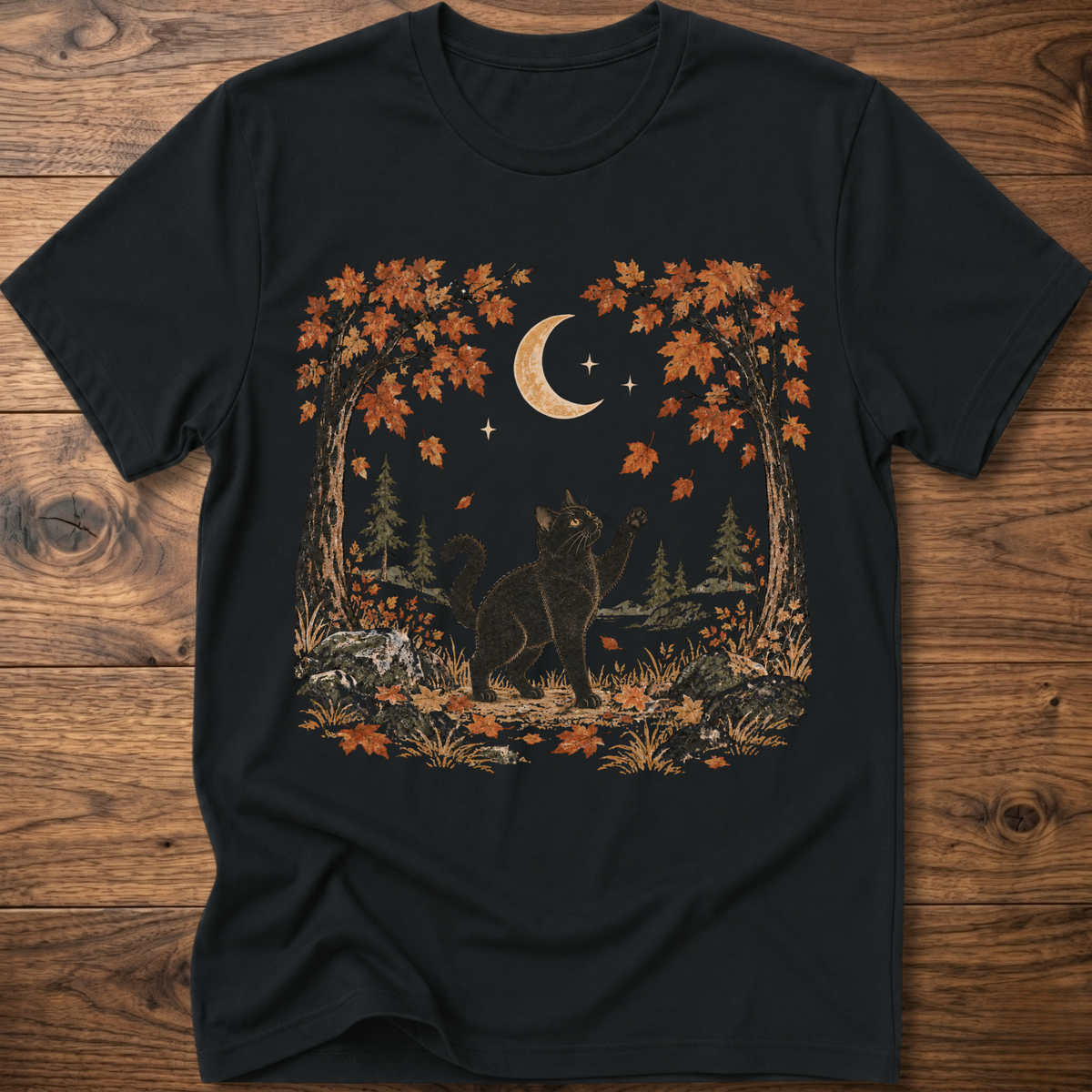 Black crewneck cat graphic t-shirt with autumn leaves, moon, and forest scene print