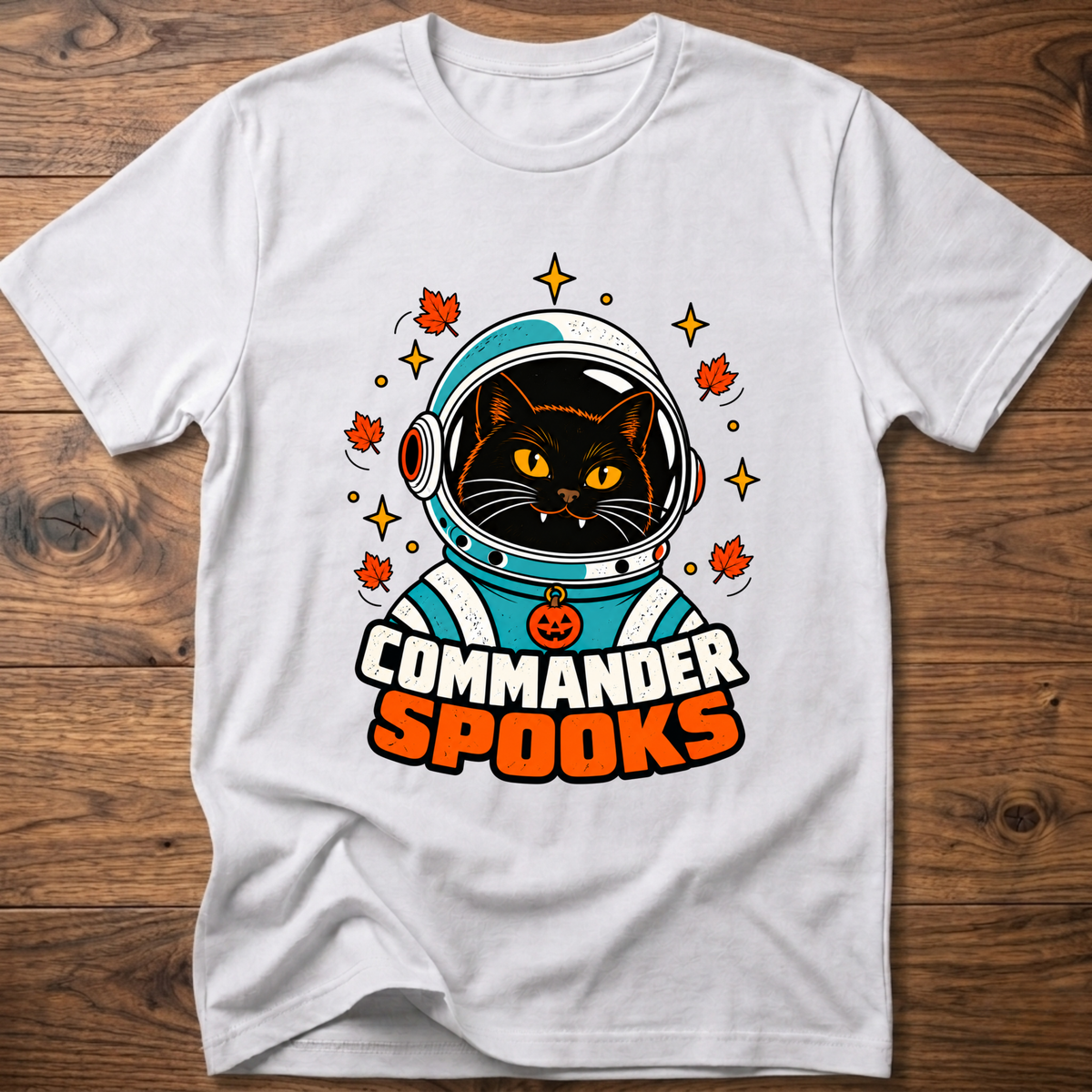White crew-neck T-shirt with cat astronaut graphic and Halloween leaves.