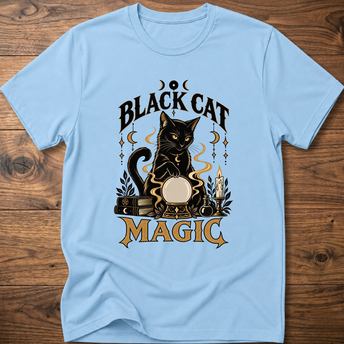 Light blue T-shirt with front graphic of a black cat and “Black Cat Magic” text.