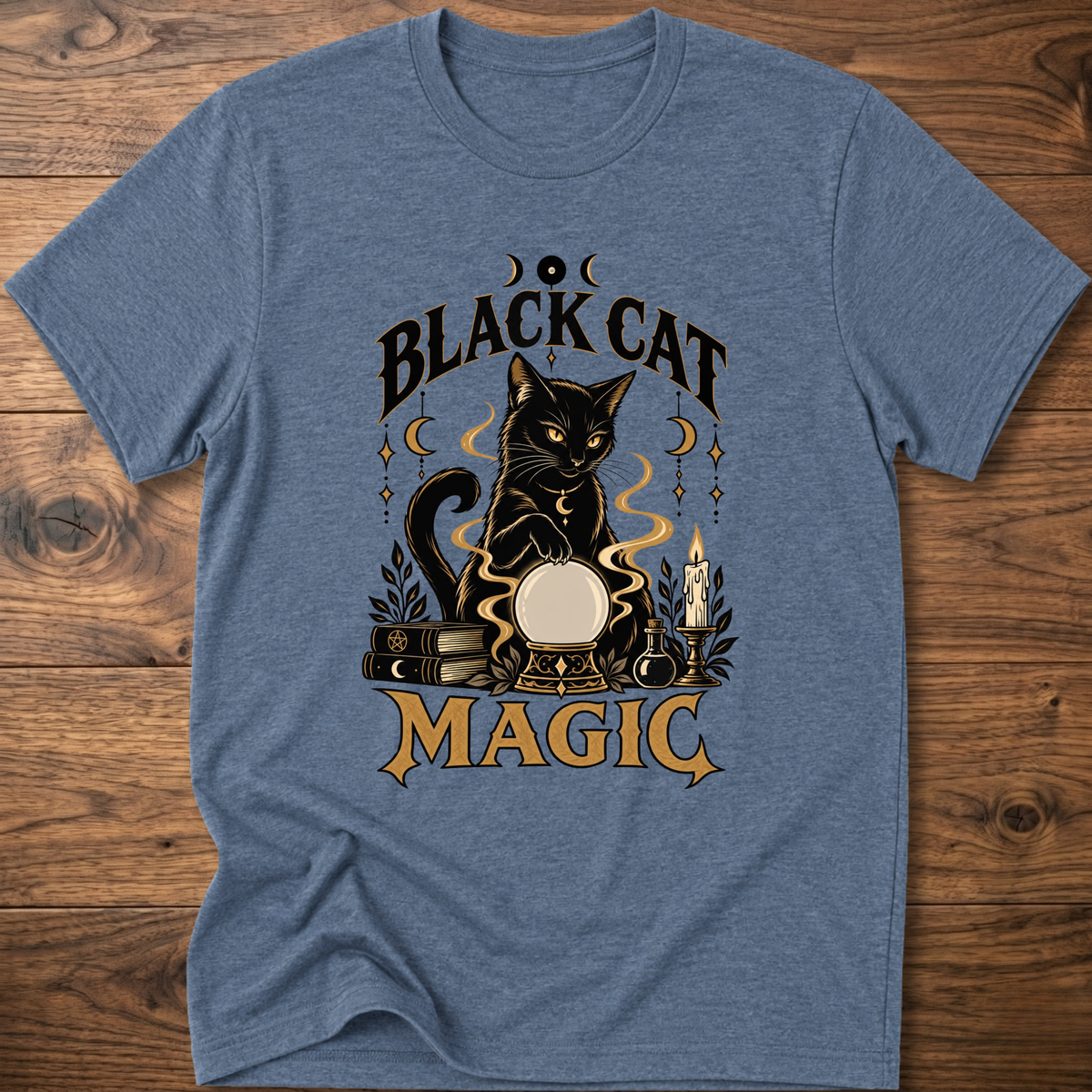 Heather blue T-shirt with front graphic of a black cat and “Black Cat Magic” text.