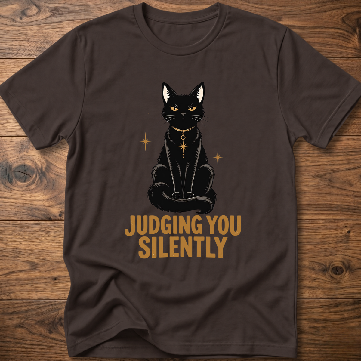 Dark brown t-shirt with black cat graphic and text “JUDGING YOU SILENTLY”