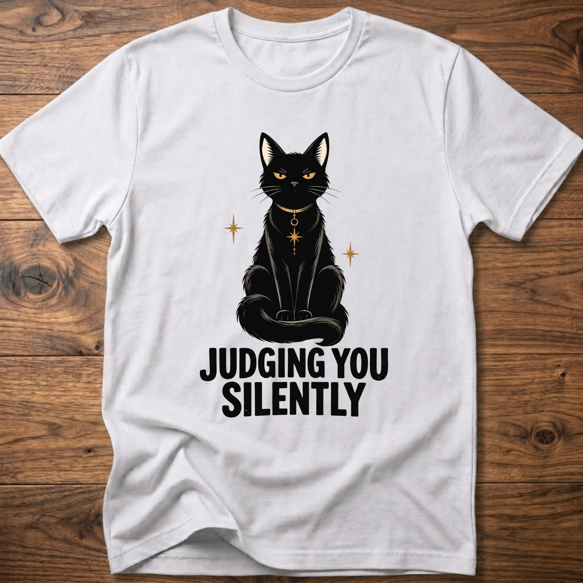 White t-shirt with black cat graphic and text “JUDGING YOU SILENTLY”