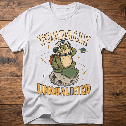 White crewneck t-shirt with frog graphic and “Unqualified” text