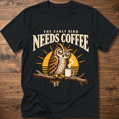 Black crew-neck T-shirt with owl perched on a branch beside a coffee mug graphic