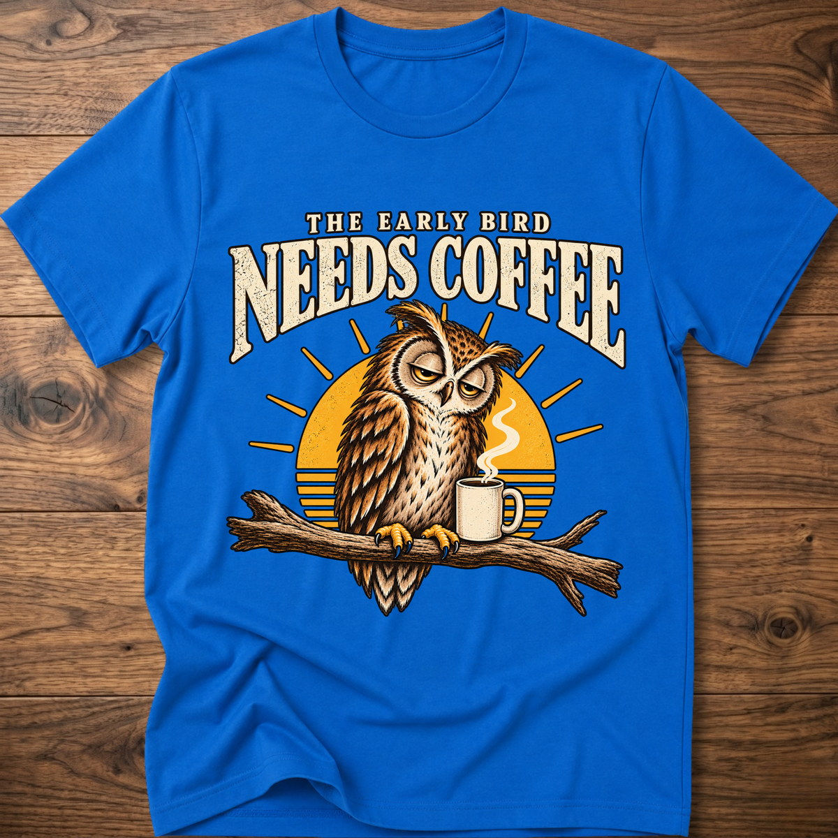 Royal blue crew-neck T-shirt with owl perched on a branch beside a coffee mug graphic