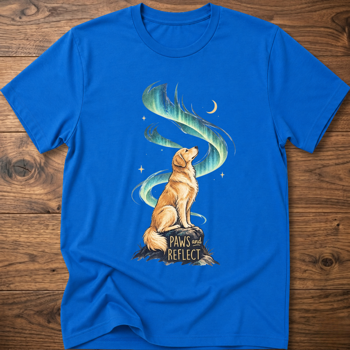 Royal blue T-shirt with cat graphic, teal-blue swirl, 'Paws & Reflect' print