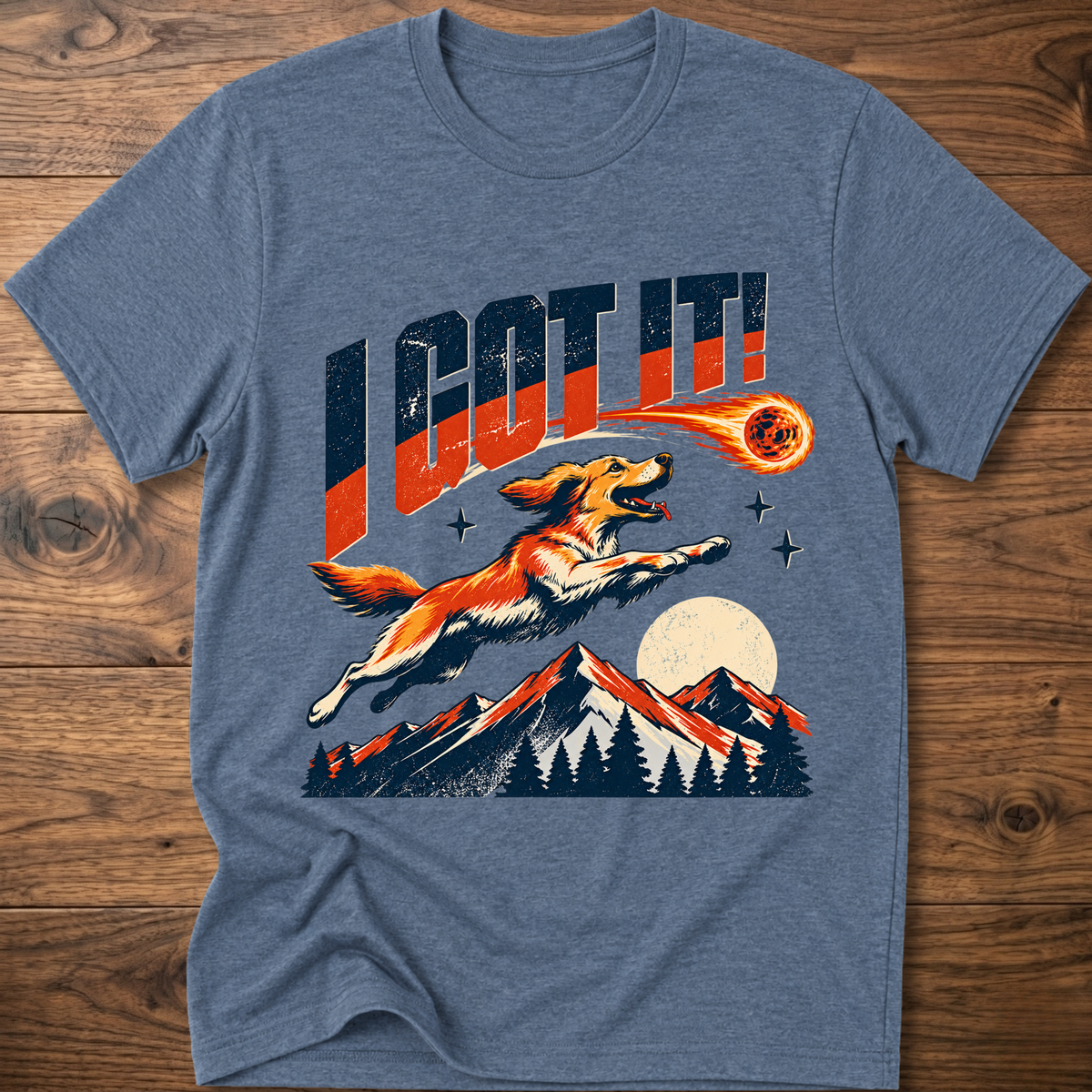 Heather blue T-shirt with 'I GOT IT' retro dog graphic and sunset mountains