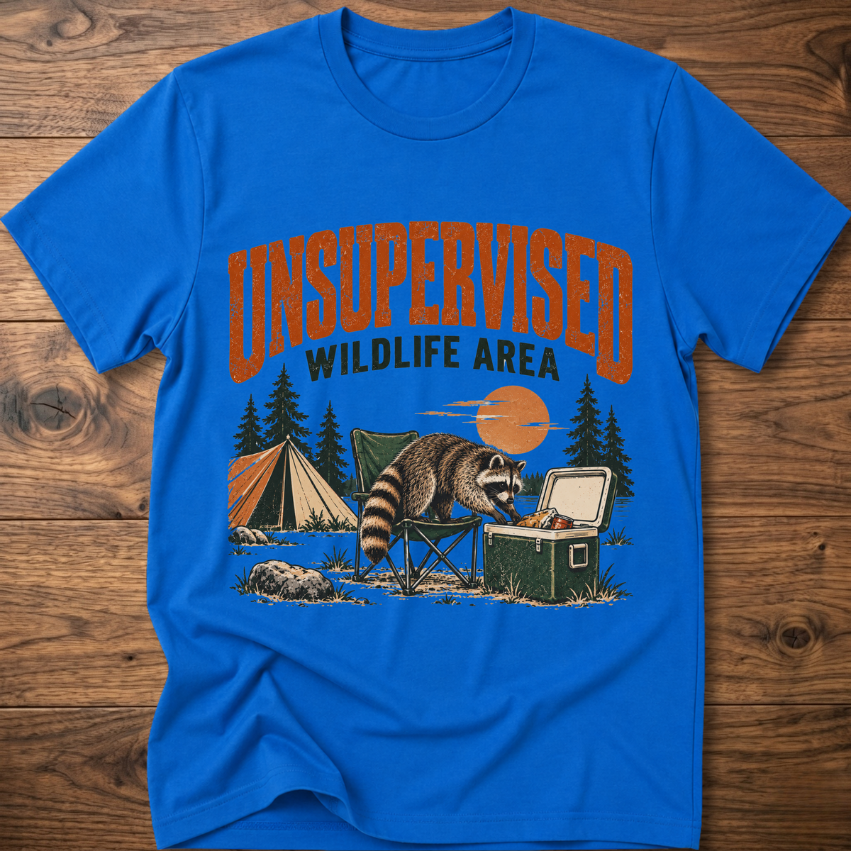 Royal blue graphic T-shirt with raccoon and “Wildlife Area” illustration