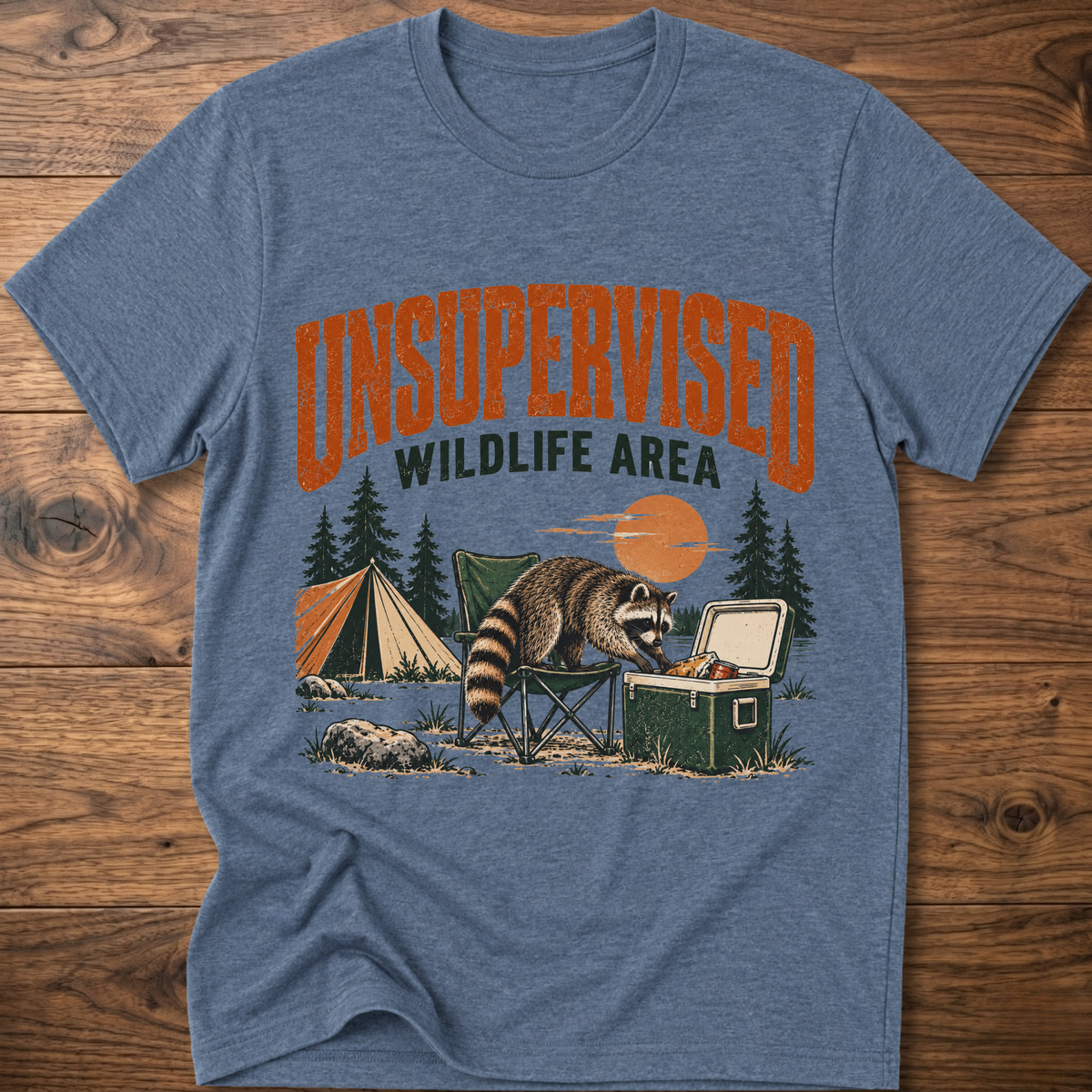 Heather indigo graphic T-shirt with raccoon and “Wildlife Area” illustration