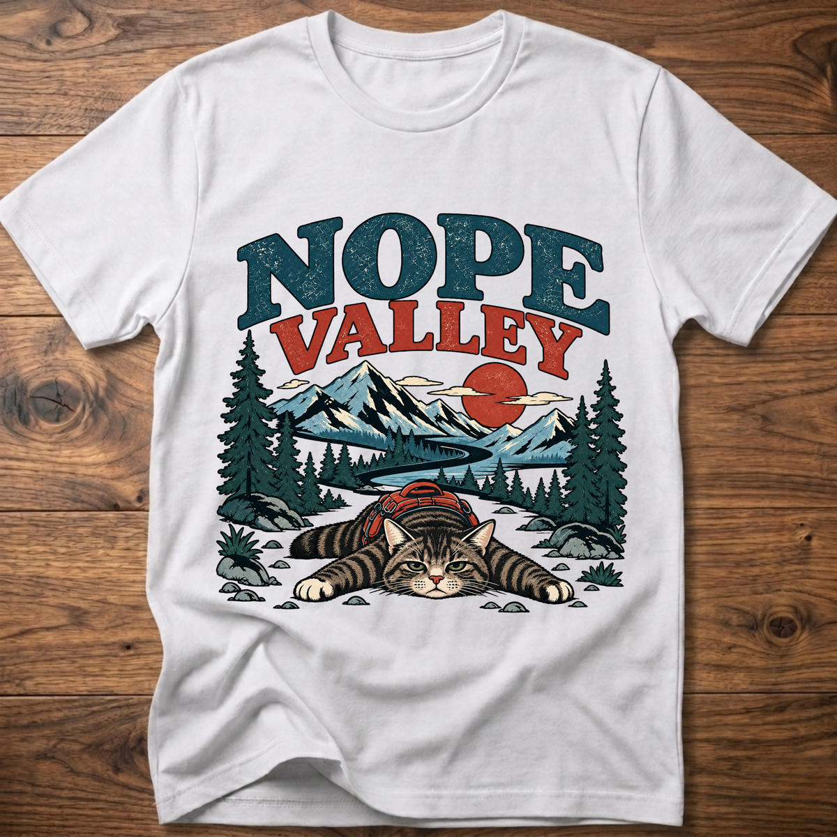 White cat T-shirt with Nope Valley mountain forest graphic