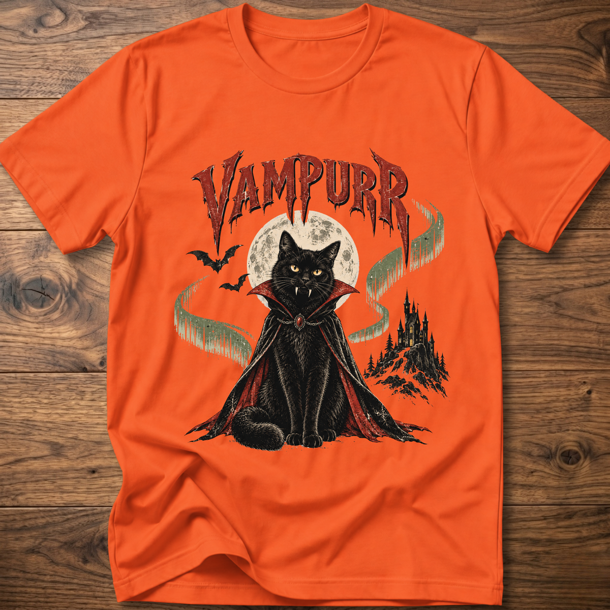 Orange t-shirt with vampire cat graphic and “Vampurr” lettering