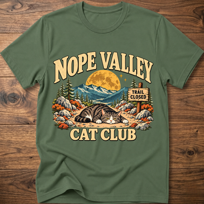Military green T-shirt with 'NOPE VALLEY CAT CLUB' cat graphic and trail closed sign