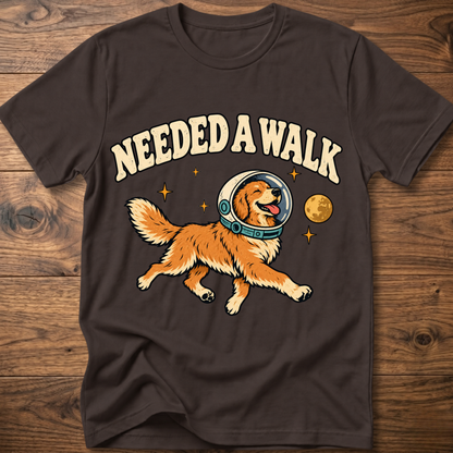 Dark chocolate T-shirt with “Needed A Walk” dog-in-helmet graphic on front