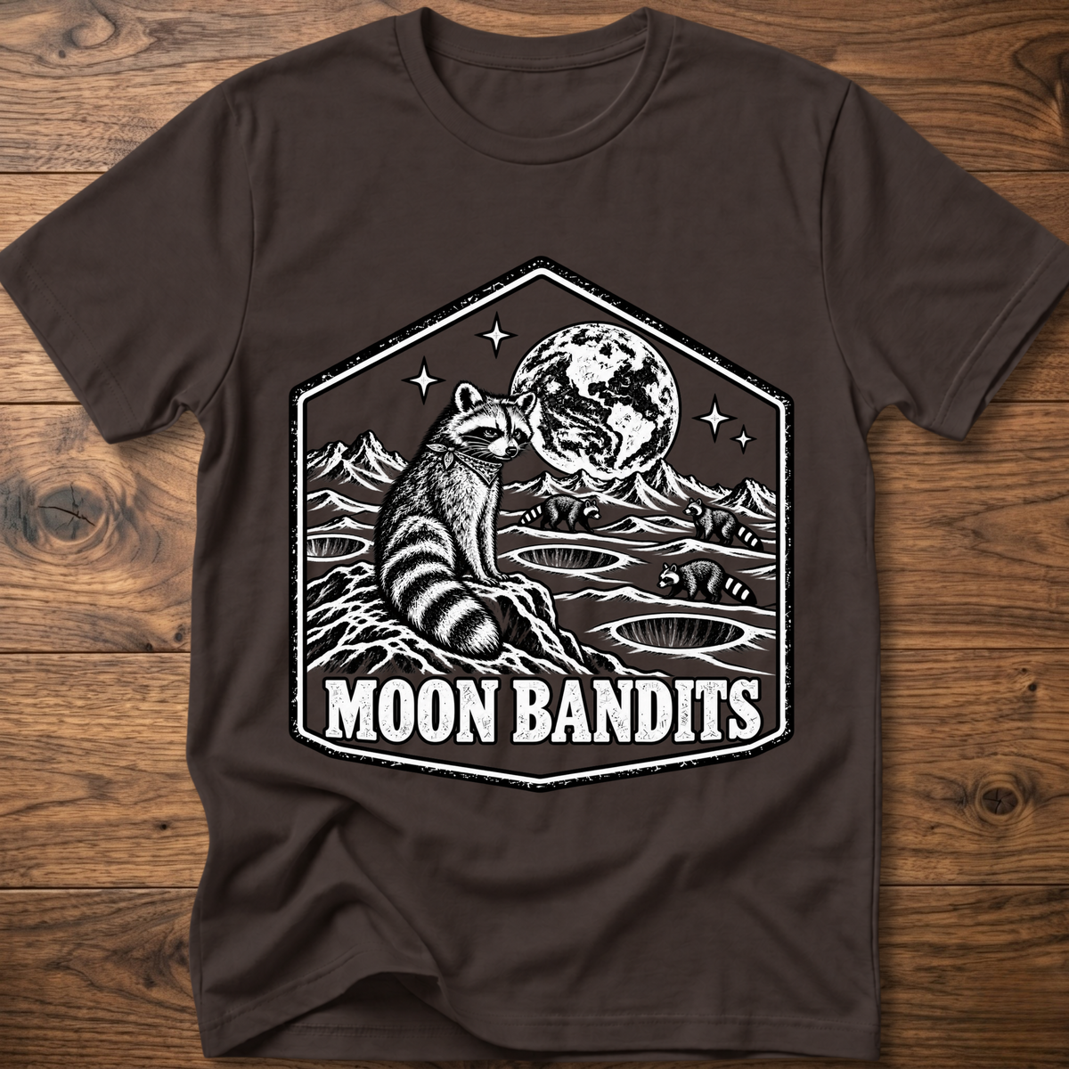 Dark brown Moon Bandits T-shirt with raccoon and full moon landscape graphic