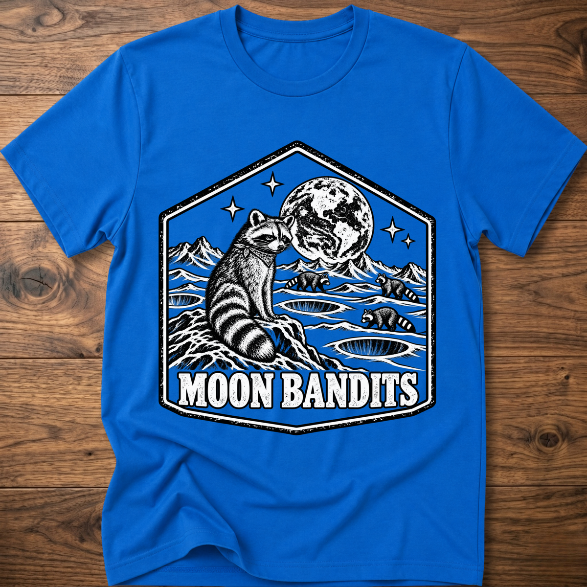 Royal blue Moon Bandits T-shirt with raccoon and full moon landscape graphic