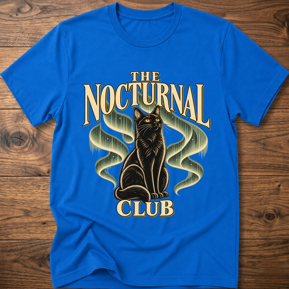 Royal blue T-shirt with “The Nocturnal Club” cat graphic on the front