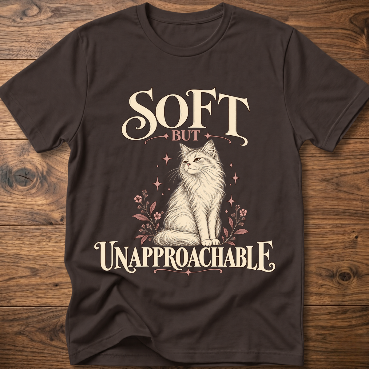 Dark brown soft cat T-shirt with front cat graphic and “Soft but Unapproachable” text