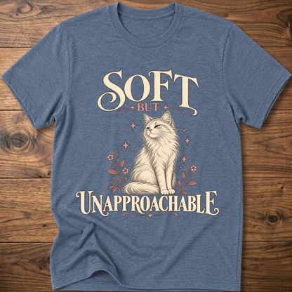 Heather blue soft cat T-shirt with front cat graphic and “Soft but Unapproachable” text