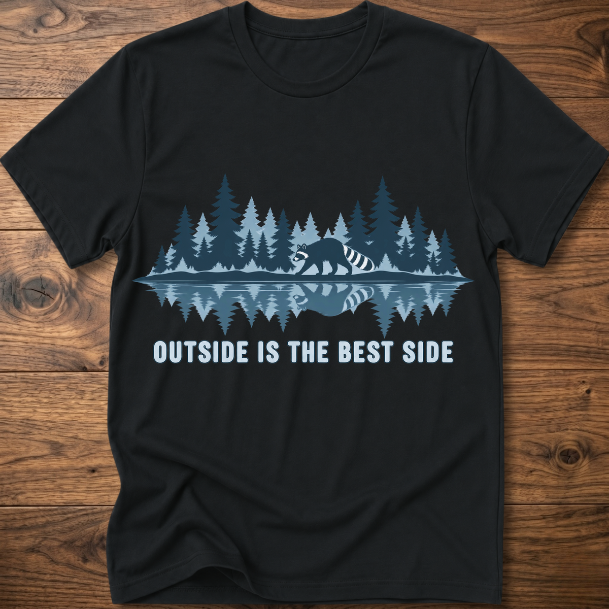 Black crew-neck T-shirt with blue raccoon tree scene graphic and “OUTSIDE IS THE BEST SIDE” text