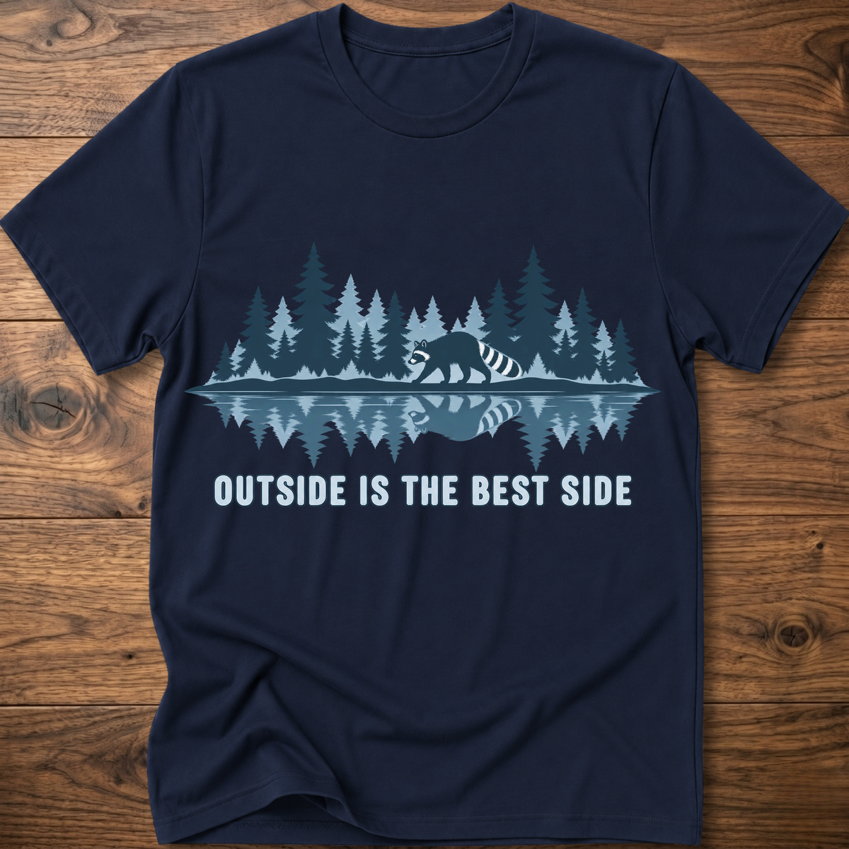 Navy crew-neck T-shirt with blue raccoon tree scene graphic and “OUTSIDE IS THE BEST SIDE” text