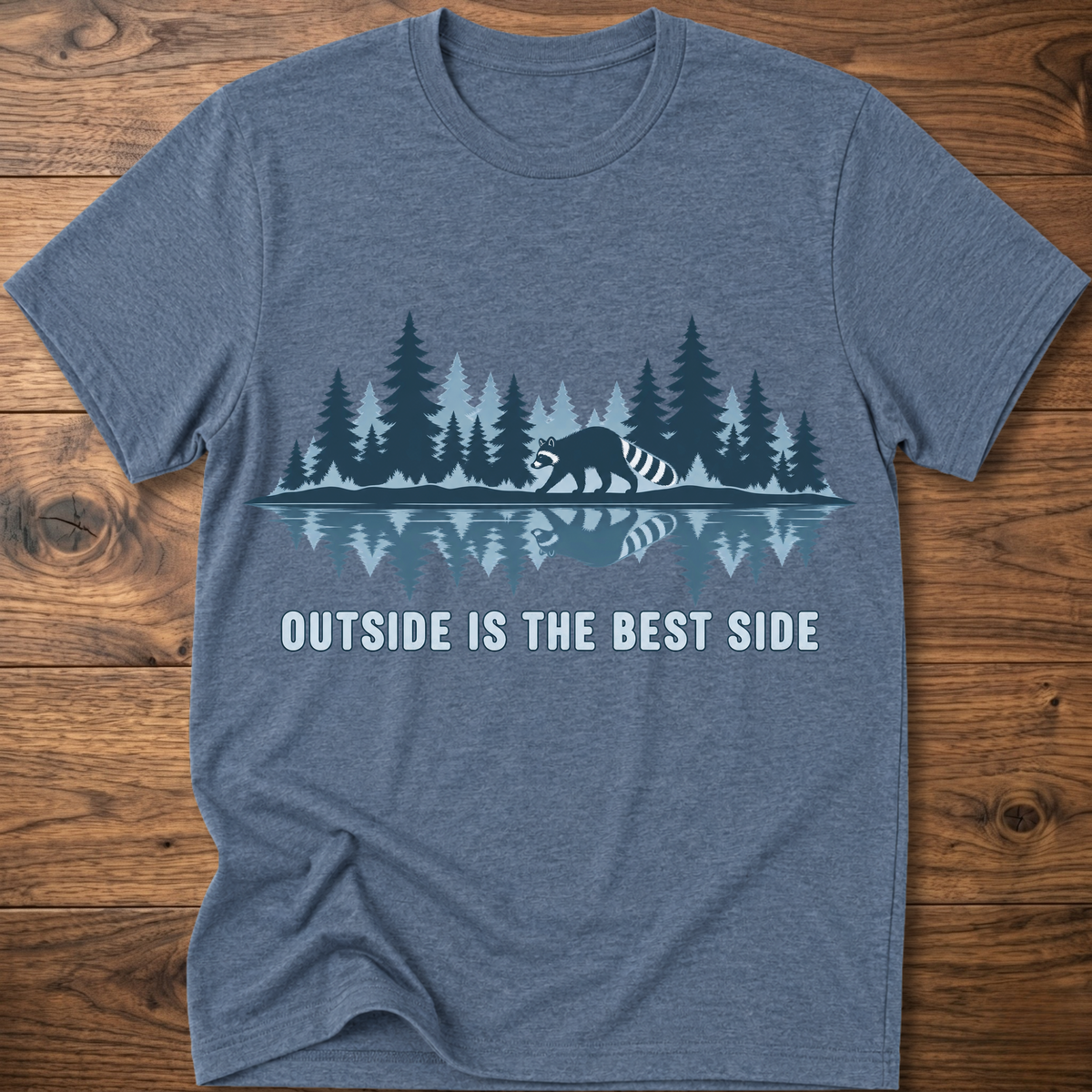 Heather blue crew-neck T-shirt with blue raccoon tree scene graphic and “OUTSIDE IS THE BEST SIDE” text