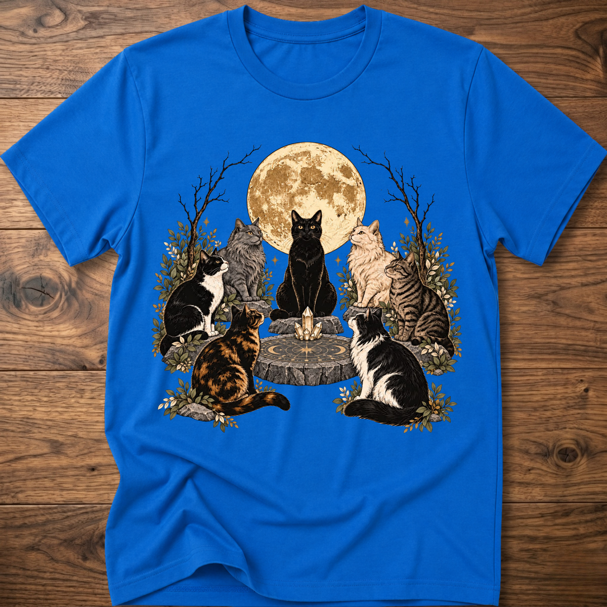 Bright blue crew-neck t-shirt with illustrated cats and full moon graphic