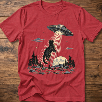 Red crewneck t-shirt with black cat under UFO beam over forest night scene
