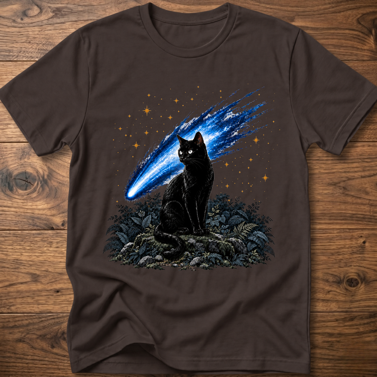 Dark brown cat t-shirt with glowing blue comet graphic and starry night scene on front