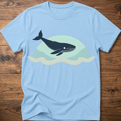 Light blue crew-neck t-shirt with dark whale graphic over teal waves design