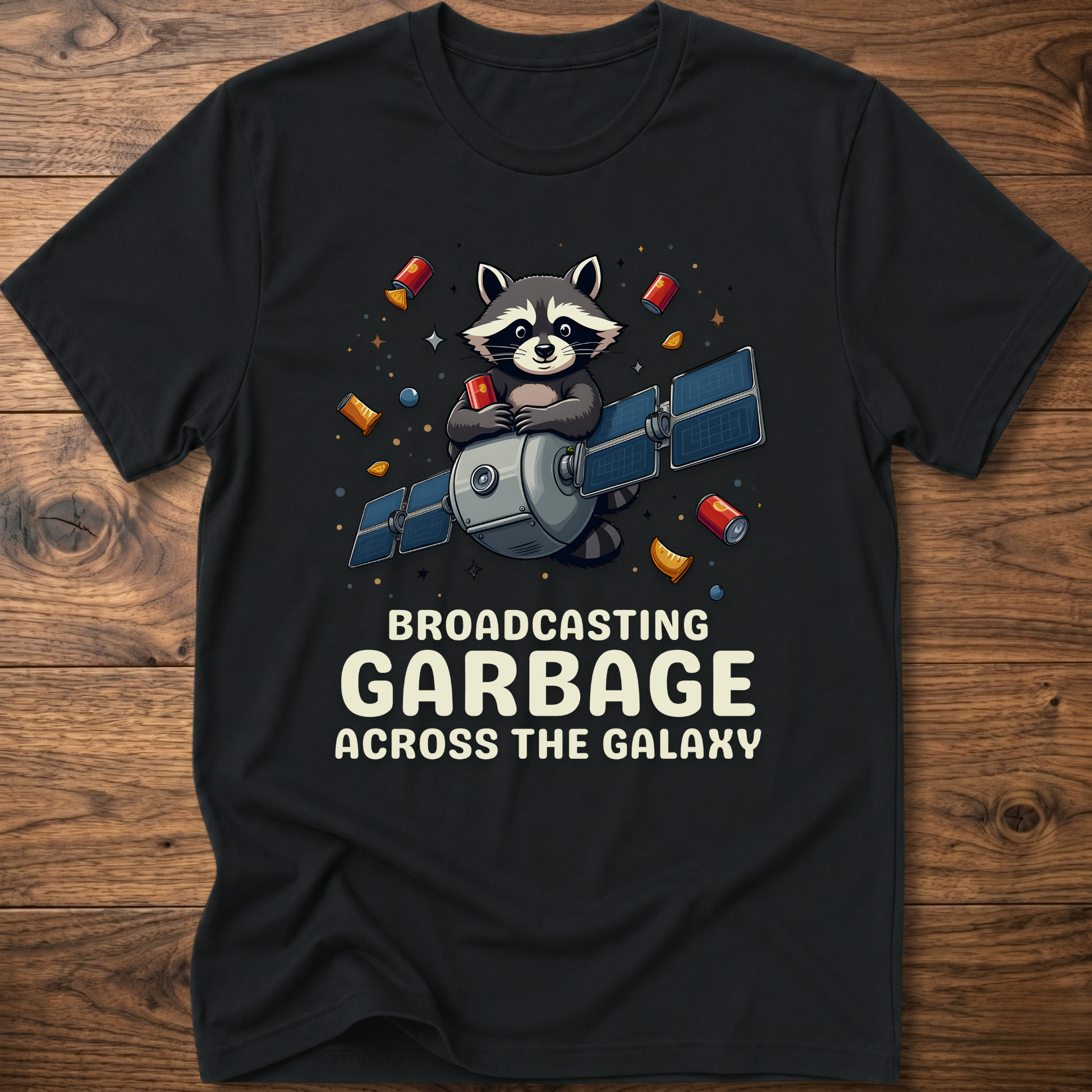 Black crew-neck T-shirt with raccoon holding megaphone graphic and “Broadcasting Garbage” text.