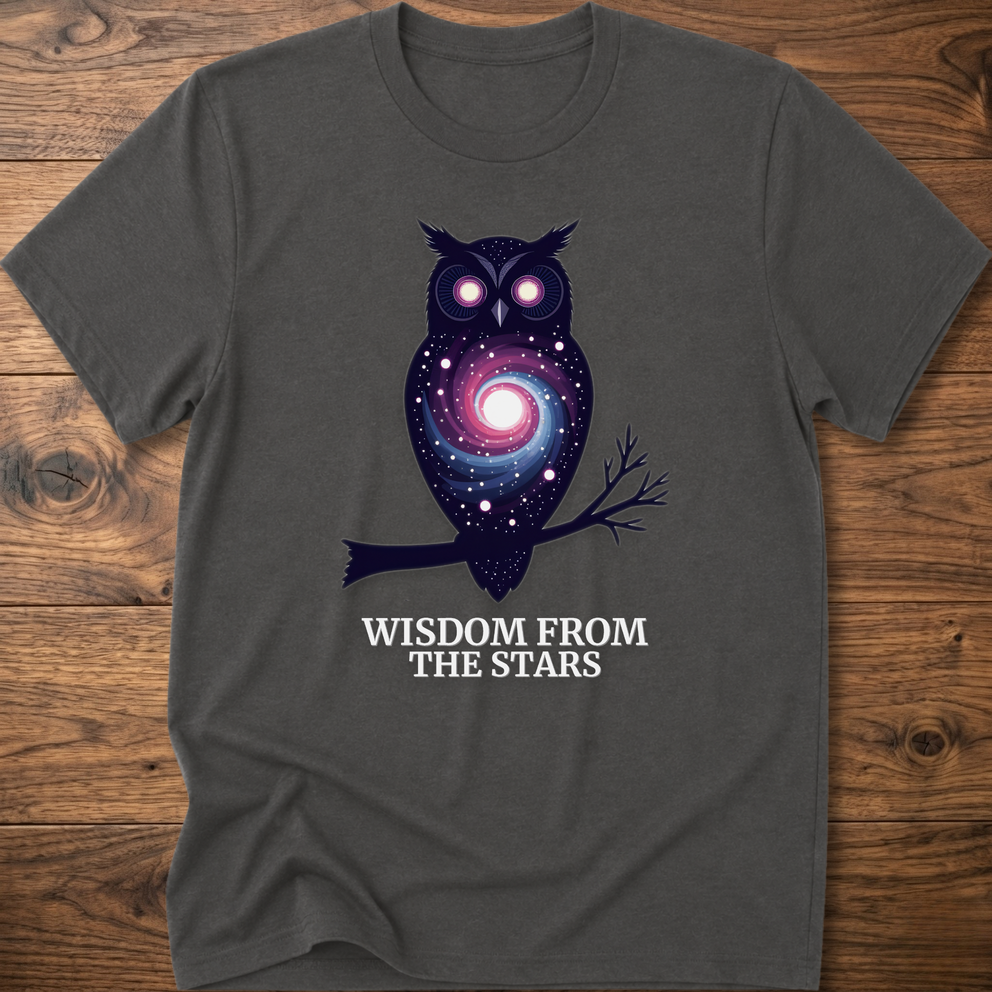 Dark heather gray owl graphic t-shirt with glowing eyes and “Wisdom from the Stars”