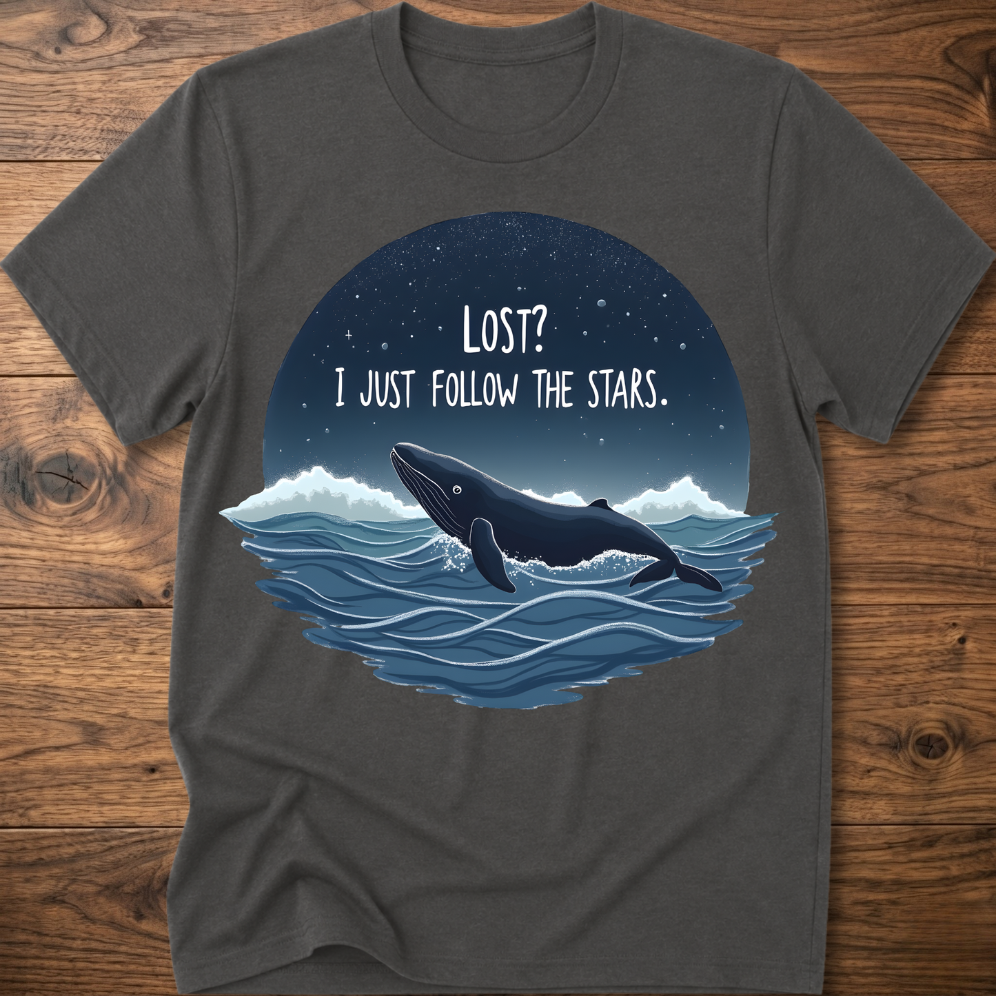 Heather gray whale graphic t-shirt with circular “LOST? I JUST FOLLOW THE STARS.” print