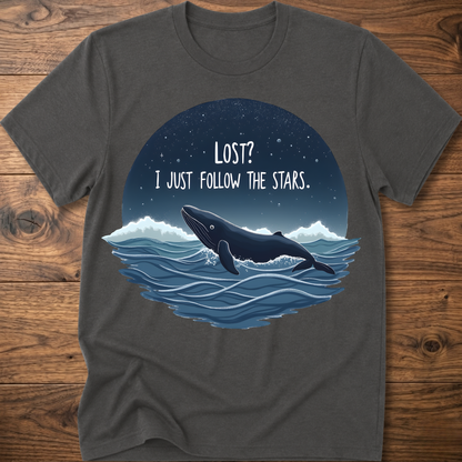 Heather gray whale graphic t-shirt with circular “LOST? I JUST FOLLOW THE STARS.” print