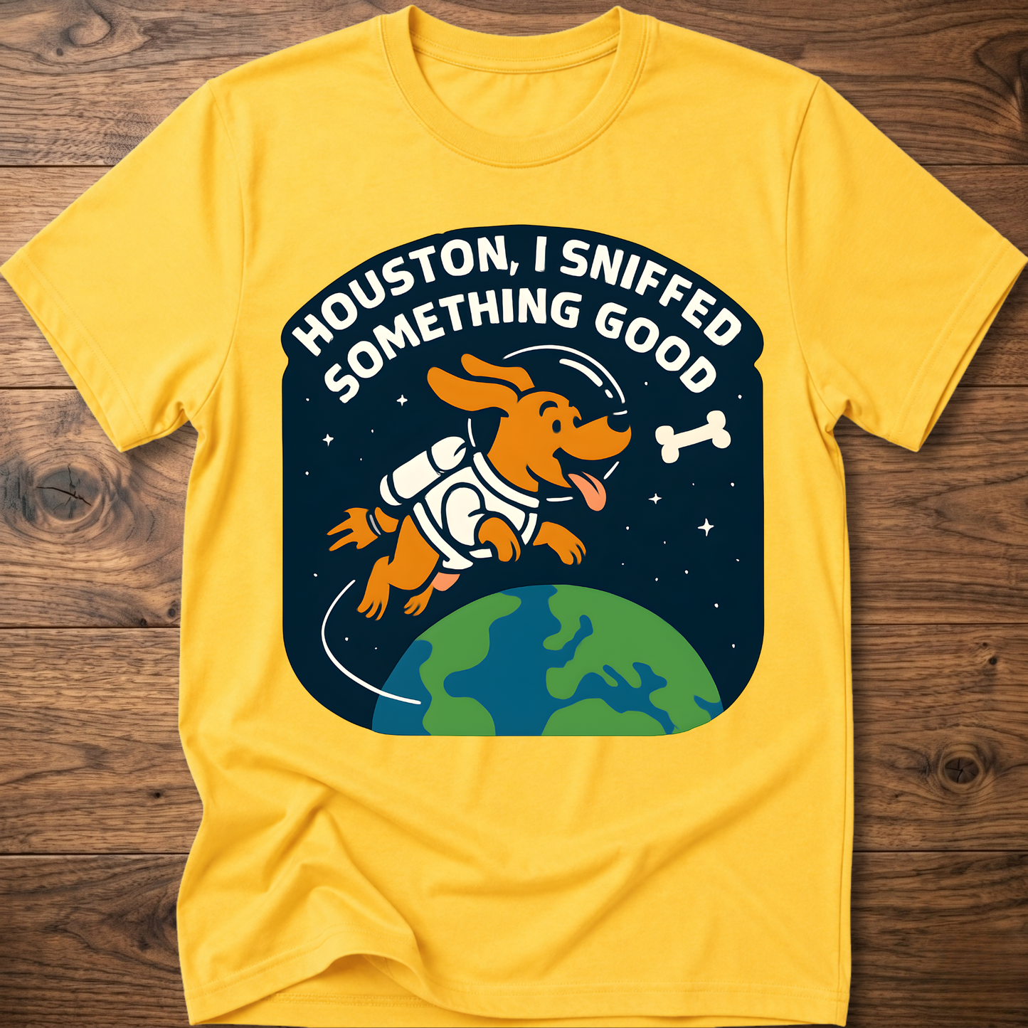 Yellow dog-themed graphic T-shirt with bone and earth illustration