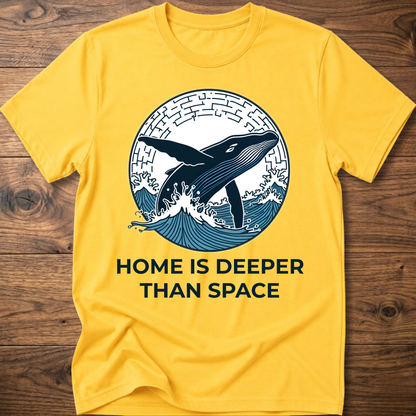 Yellow T-shirt with whale surf graphic and “HOME IS DEEPER THAN SPACE” text