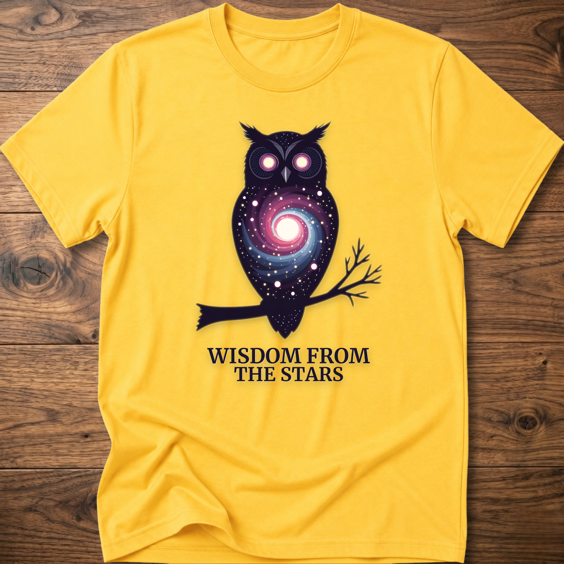 Yellow owl graphic t-shirt with glowing eyes and “Wisdom from the Stars” text