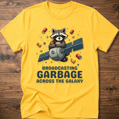 Yellow crew-neck T-shirt with raccoon holding megaphone graphic and “Broadcasting Garbage” text.