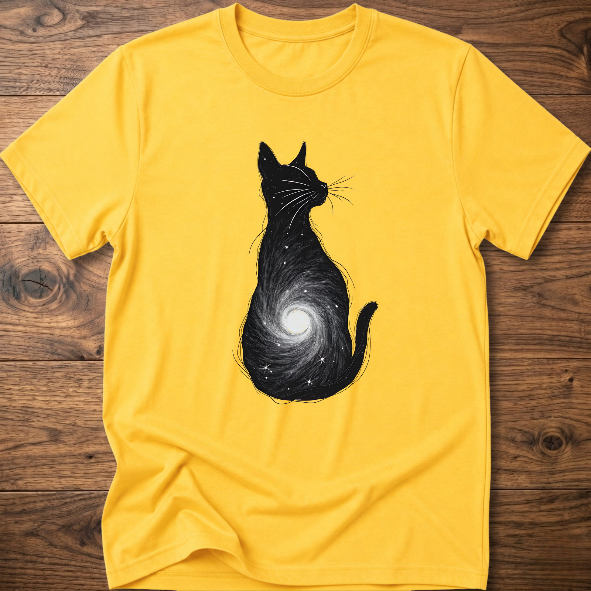 Yellow cat graphic t-shirt with black silhouette and spiral galaxy design on front