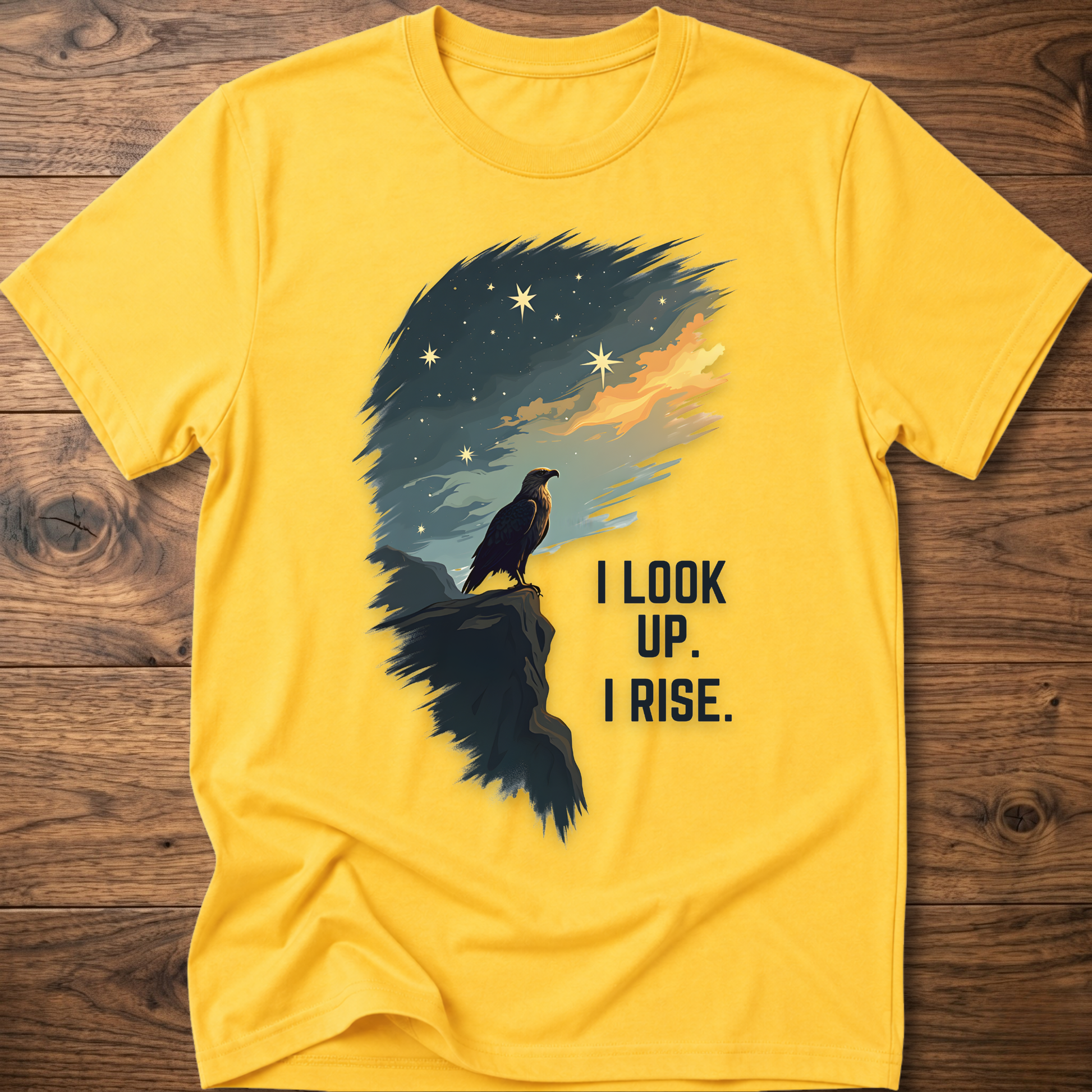 Yellow T-shirt with raven sunrise graphic and 'I LOOK UP. I RISE.'