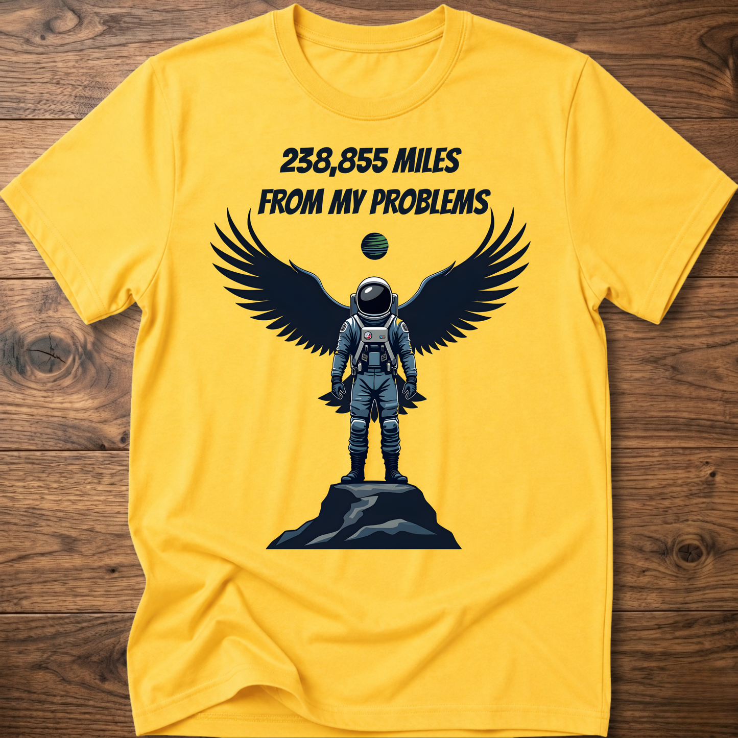 Yellow crewneck t-shirt with astronaut-eagle graphic and text '238,855 Miles'.