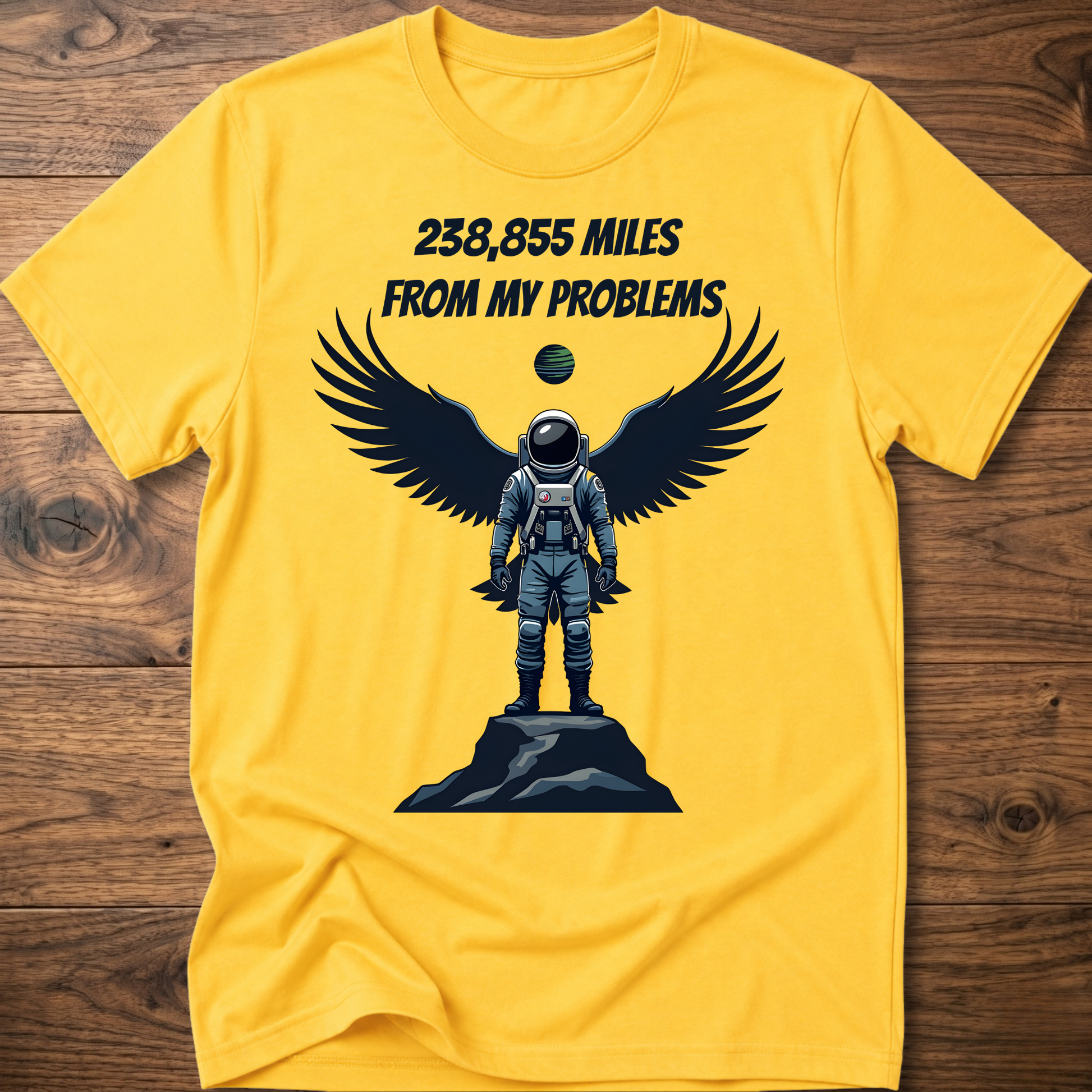 Yellow crewneck t-shirt with astronaut-eagle graphic and text '238,855 Miles'.
