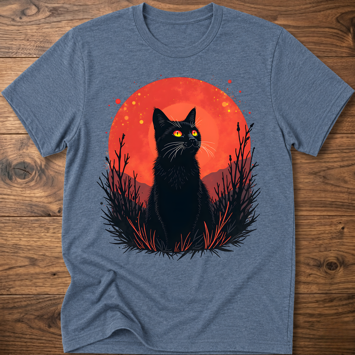 Heather blue T-shirt with black cat graphic in red-orange halo and night-plant silhouettes