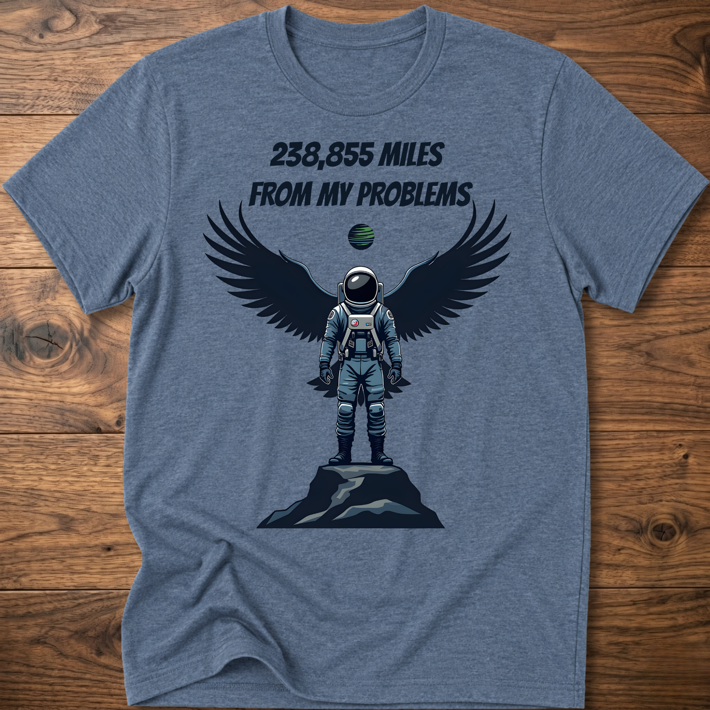 Heather blue crewneck t-shirt with astronaut-eagle graphic and text '238,855 Miles'.