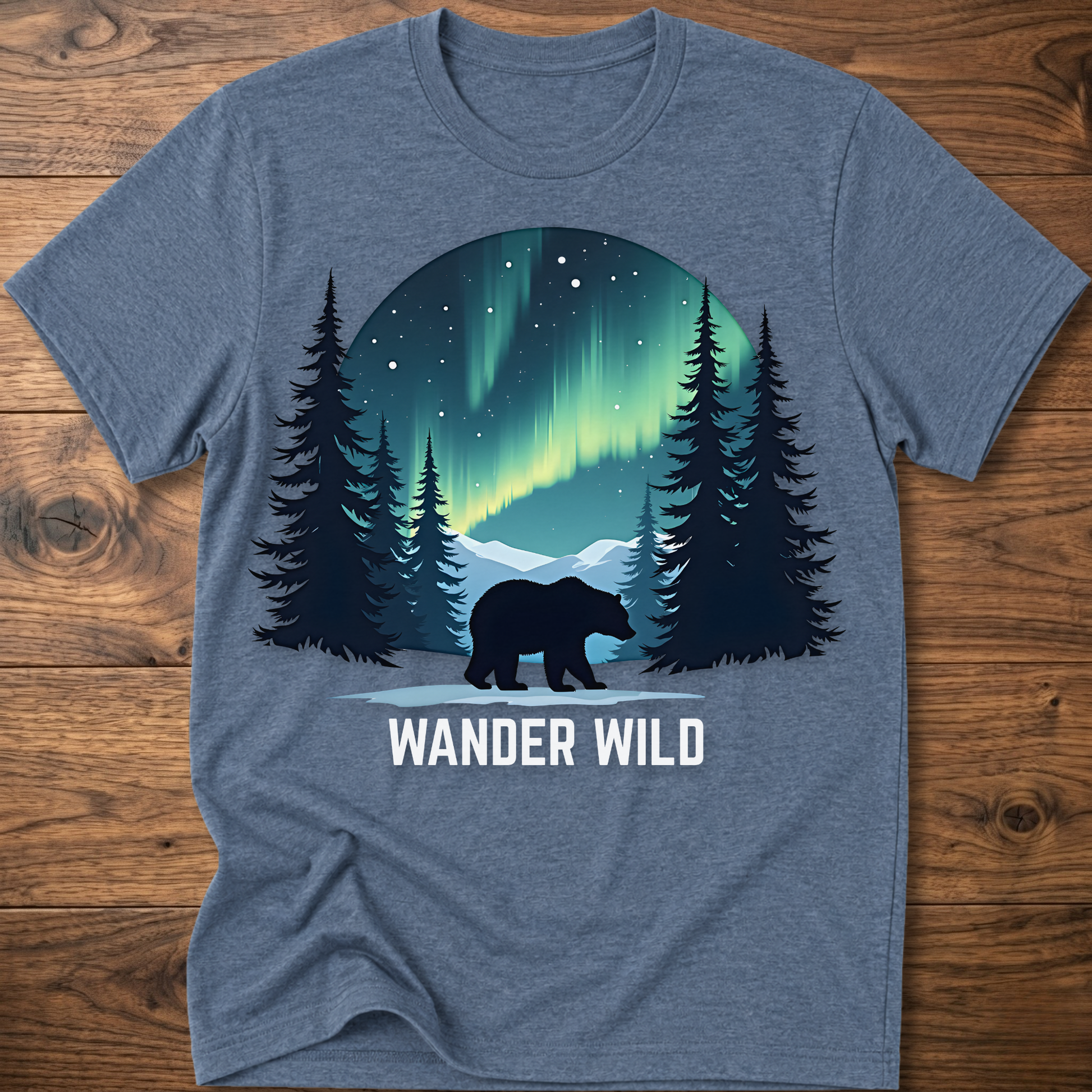 Blue heather crew-neck t-shirt with bear in forest graphic and 'Wander Wild' text